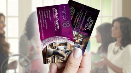 Holding two business cards at a networking event for empowering women. Now with new $8 design.